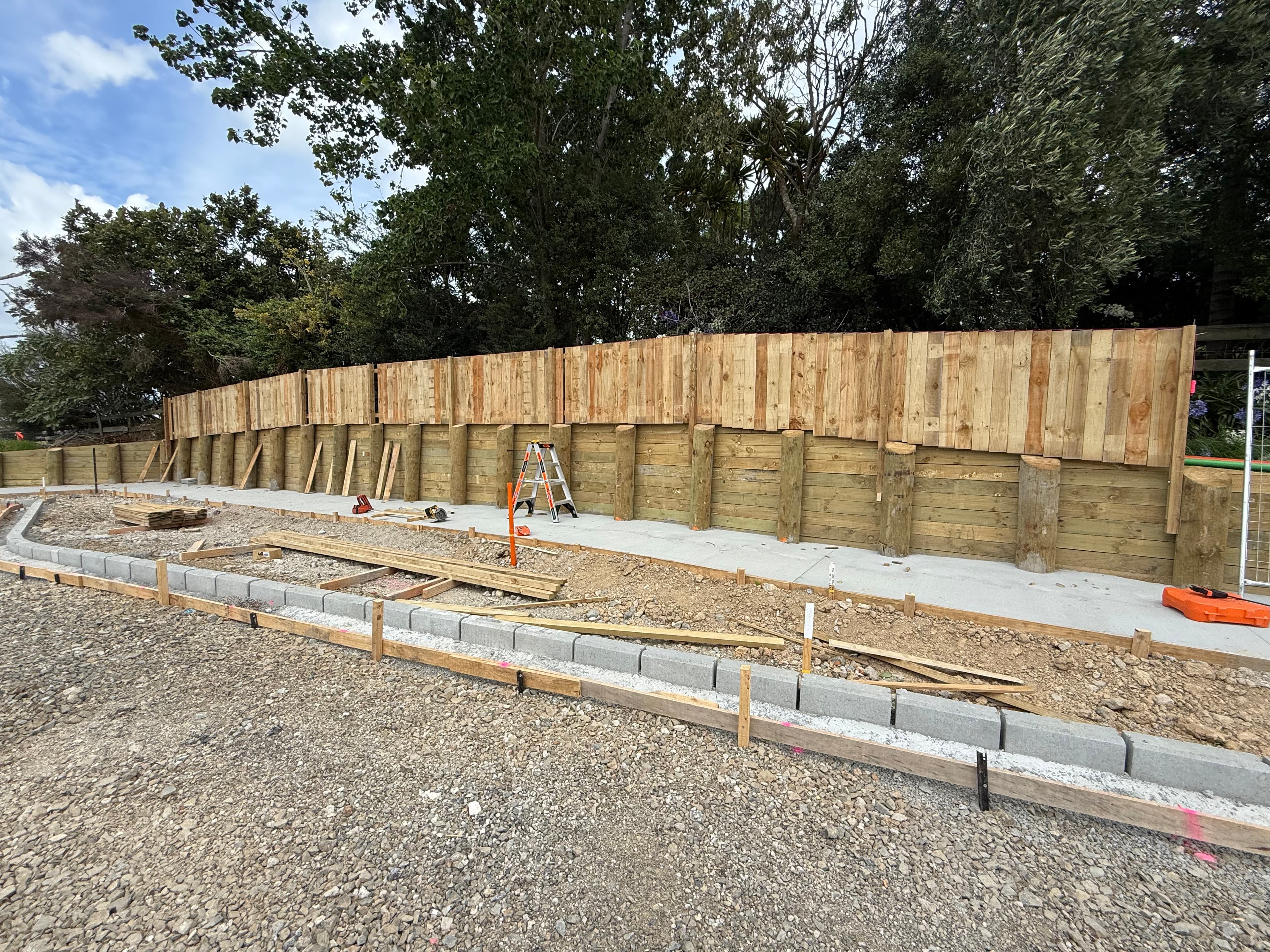 Timber retaining wall under construction on a residential site, Auckland - Bromley Group