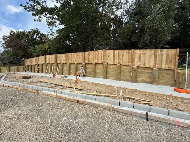 Timber retaining wall under construction on a residential site, Auckland - Bromley Group